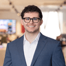 Constantine Alexos, Analyst